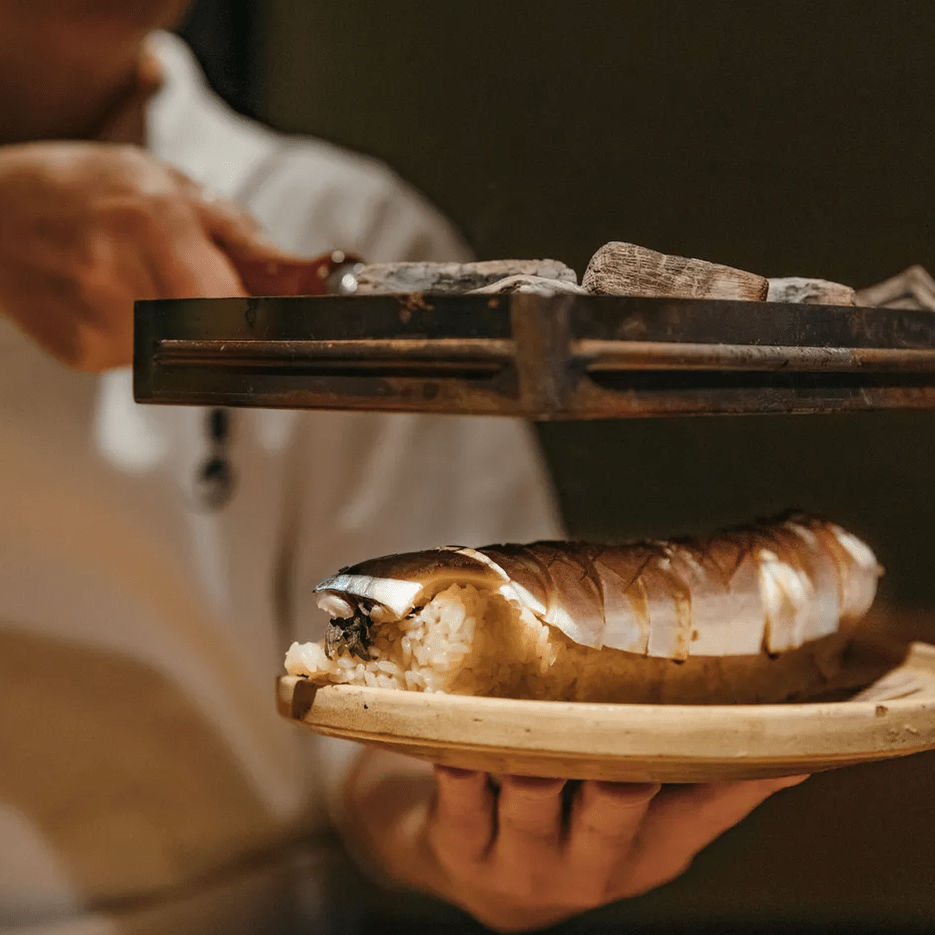 a chef preparing sushi